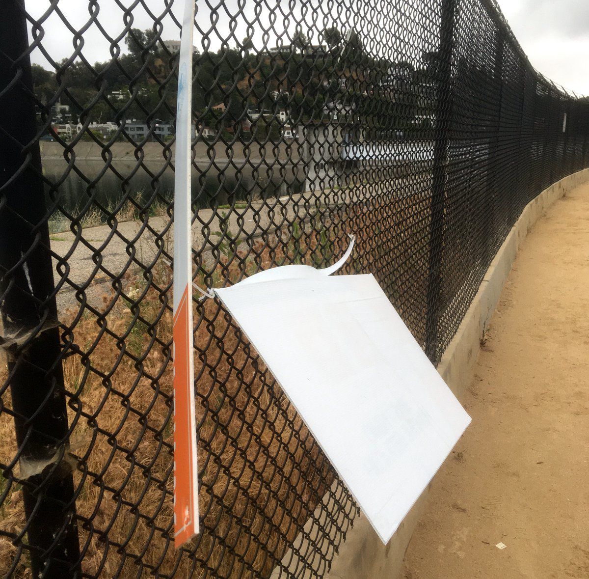 vandalized silver lake reservoir one way 3 sign eastsider reader.jpg